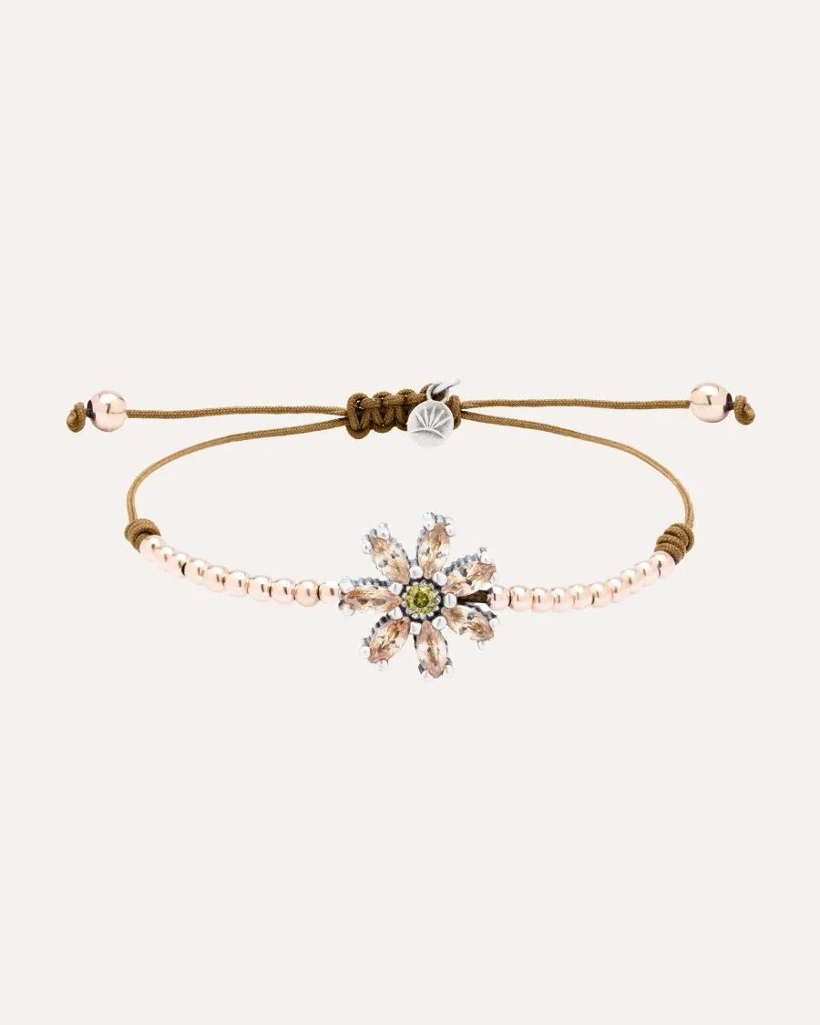 Pulsera SUNFIELD PU068491 tiene  un motivo central en forma de flor con circonitas engastadas.Se compone unas cuentas de plata chapada en 18k. de 3mm.
